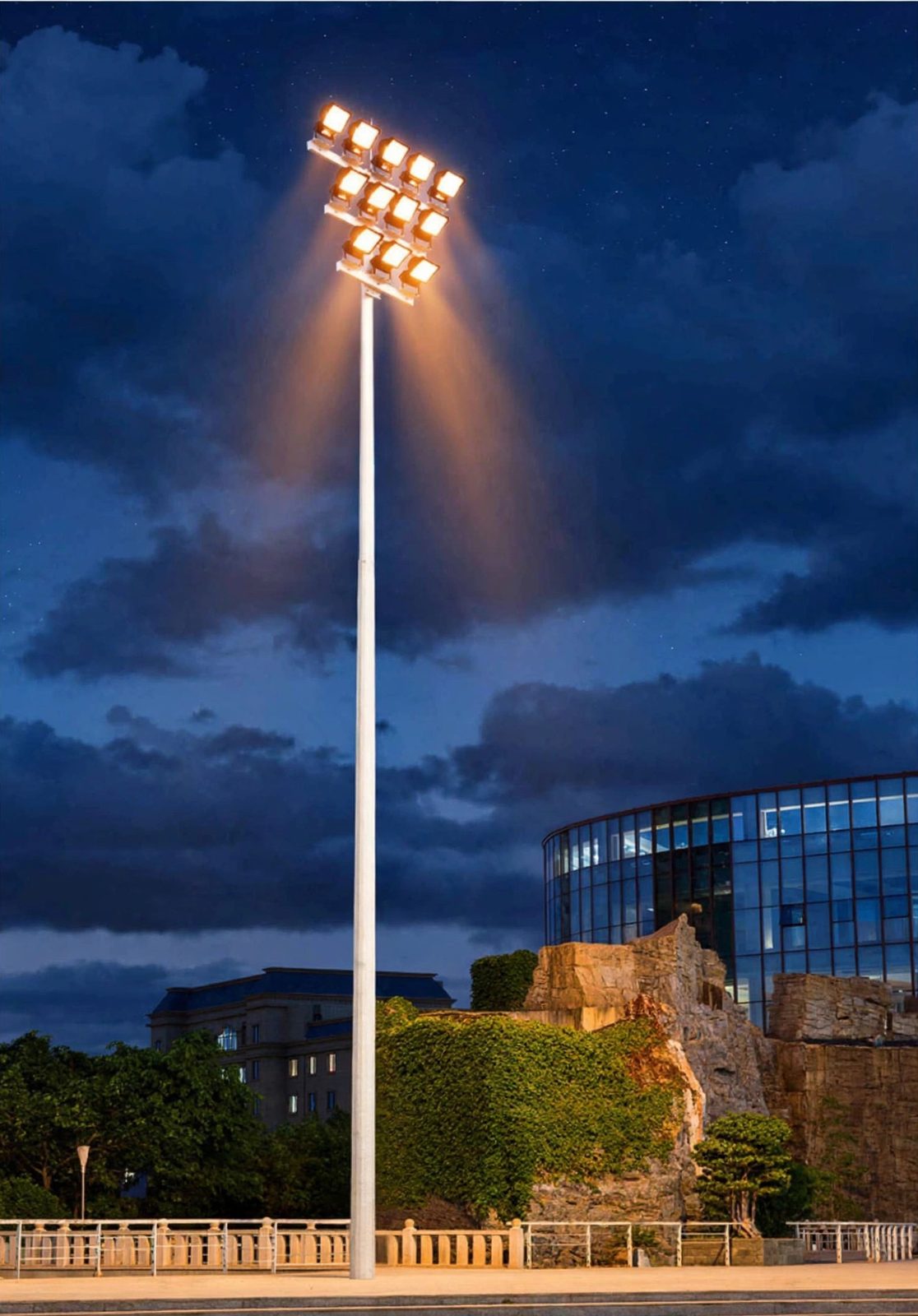 High-mast floodlight tower at night